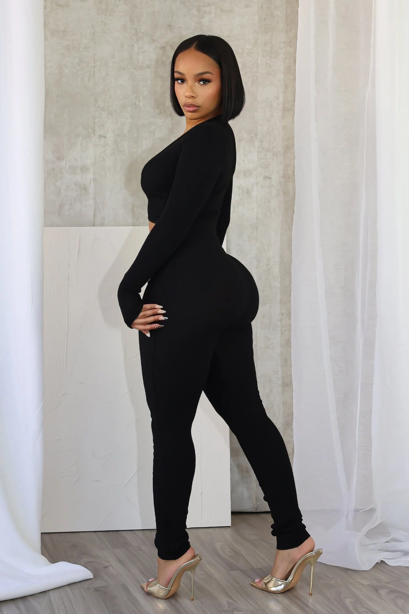 4177-Adellia-Ribbed-Knit-Deep-V-Neck-Jumpsuit-4.webp Adellia Ribbed Knit Deep V-Neck Jumpsuit